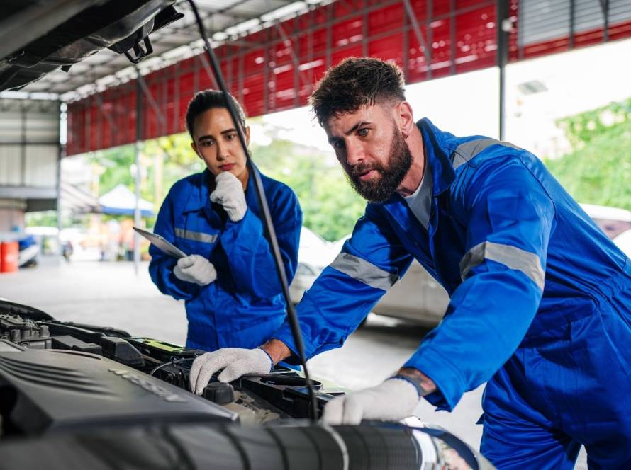 A team of mechanics perform auto maintenance services.