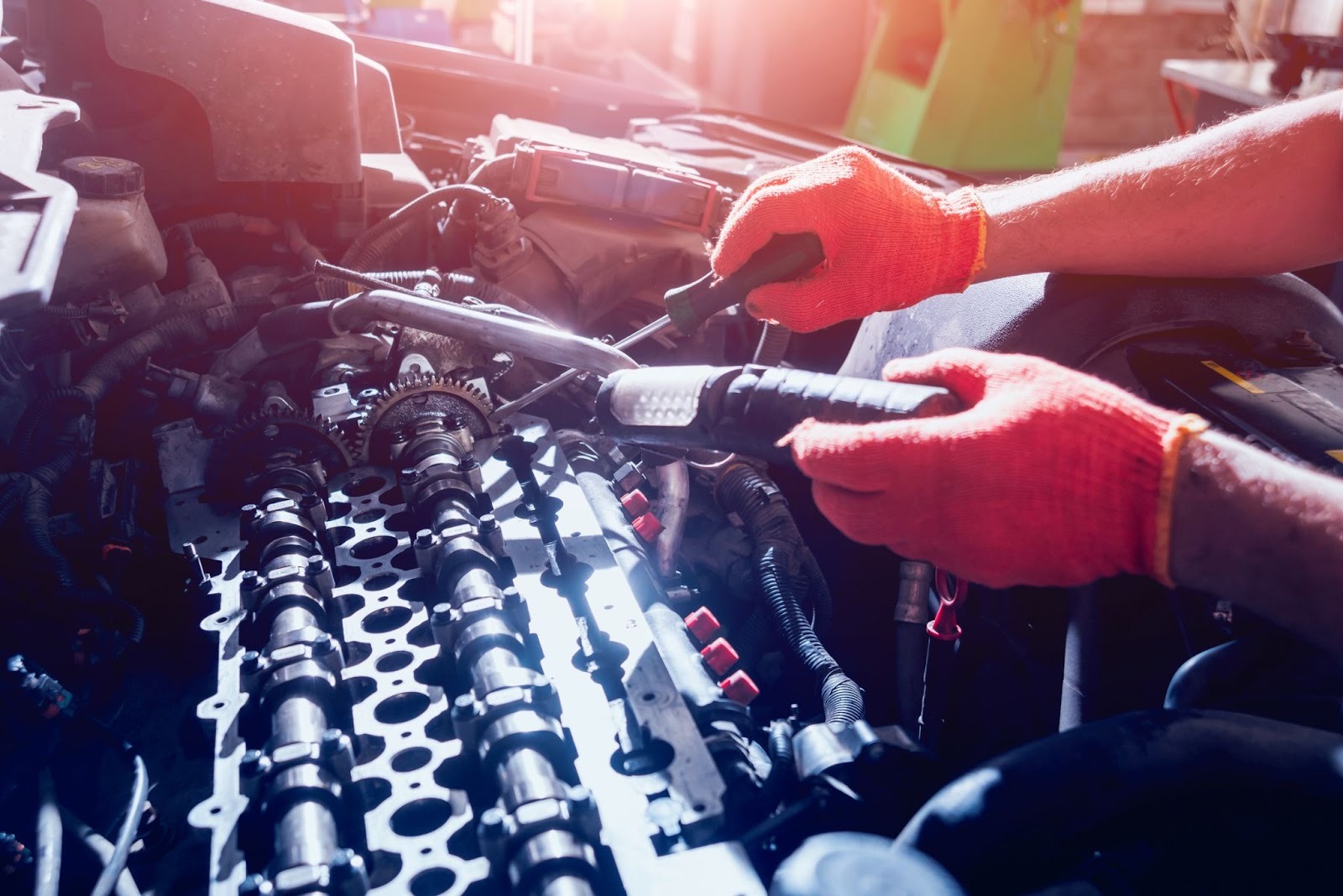 Detailed view of an auto repair specialist fixing a vehicle engine during service